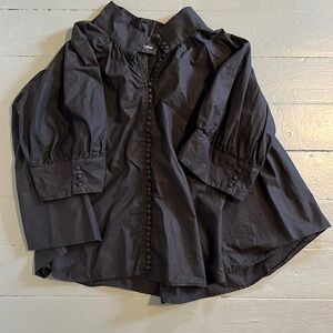 THE KOOPLES swing blouse with high neck and button detail.